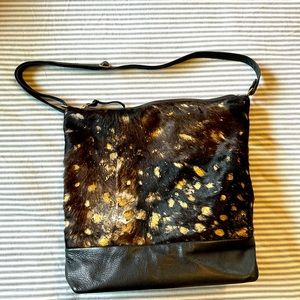 Beautiful black fur bag with gold accents